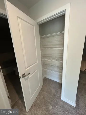 a bathroom with a glass door shower