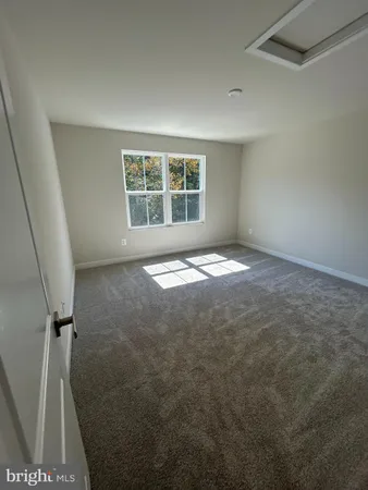 a spacious bathroom with a double vanity sink and a mirror