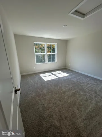 a spacious bathroom with a double vanity sink and a mirror