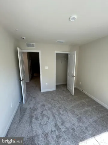 a view of empty room with empty racks