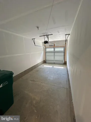 a kitchen with granite countertop a stove top oven a sink dishwasher and a refrigerator with wooden floor