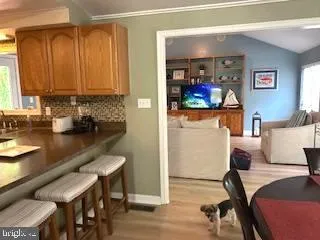 a view of a dining room with furniture and chandelier