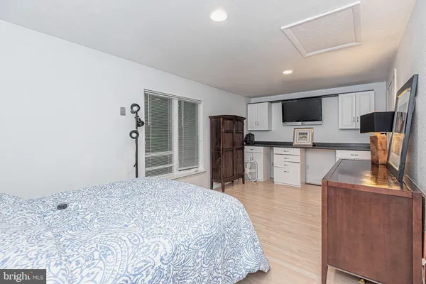 a kitchen with stainless steel appliances kitchen island granite countertop a refrigerator and a stove top oven