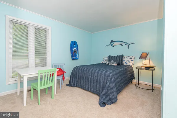 a bedroom with a bed and a table in it