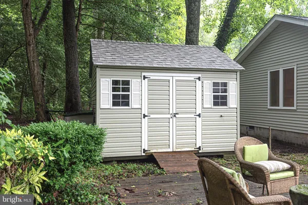 a view of backyard with seating space