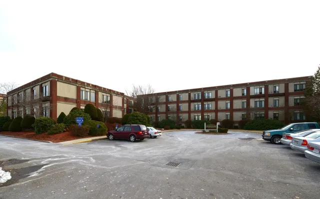 a view of a street with a building in the background