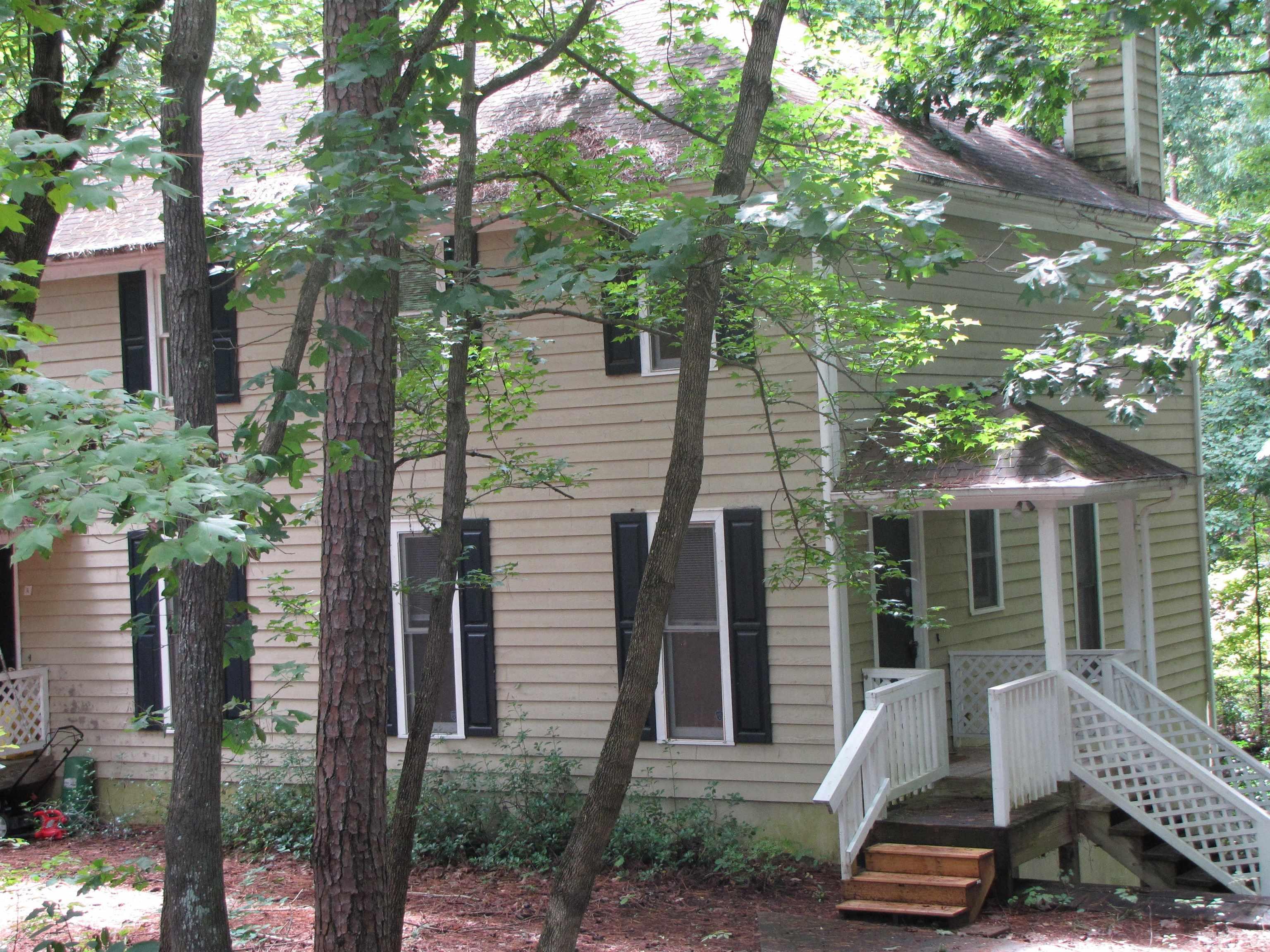 a view of a chair and tables in the balcony