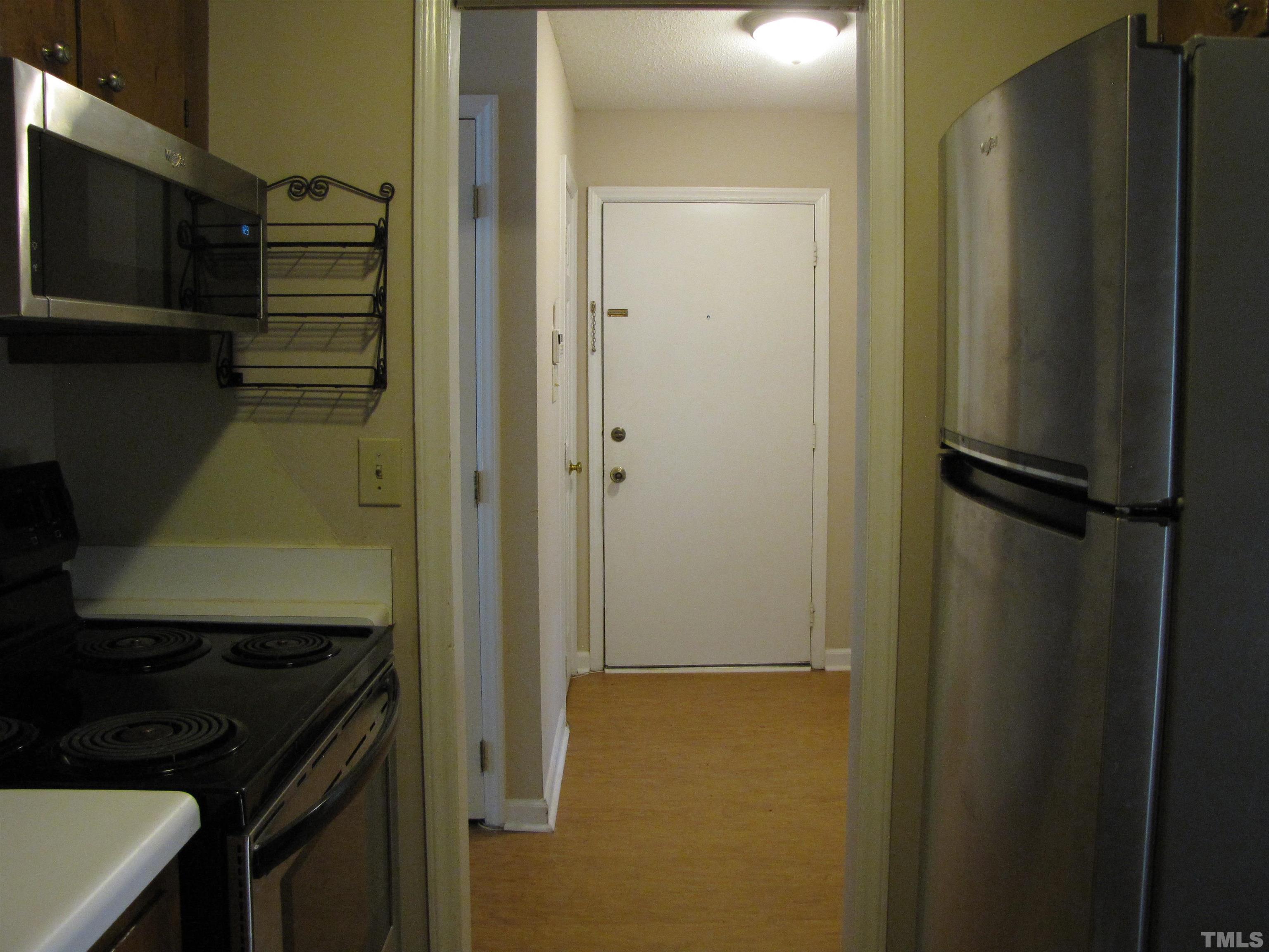 2 Carson Circle, Unit B Durham, NC 27705 - Photo 2 of 15 a kitchen with a refrigerator and a stove top oven