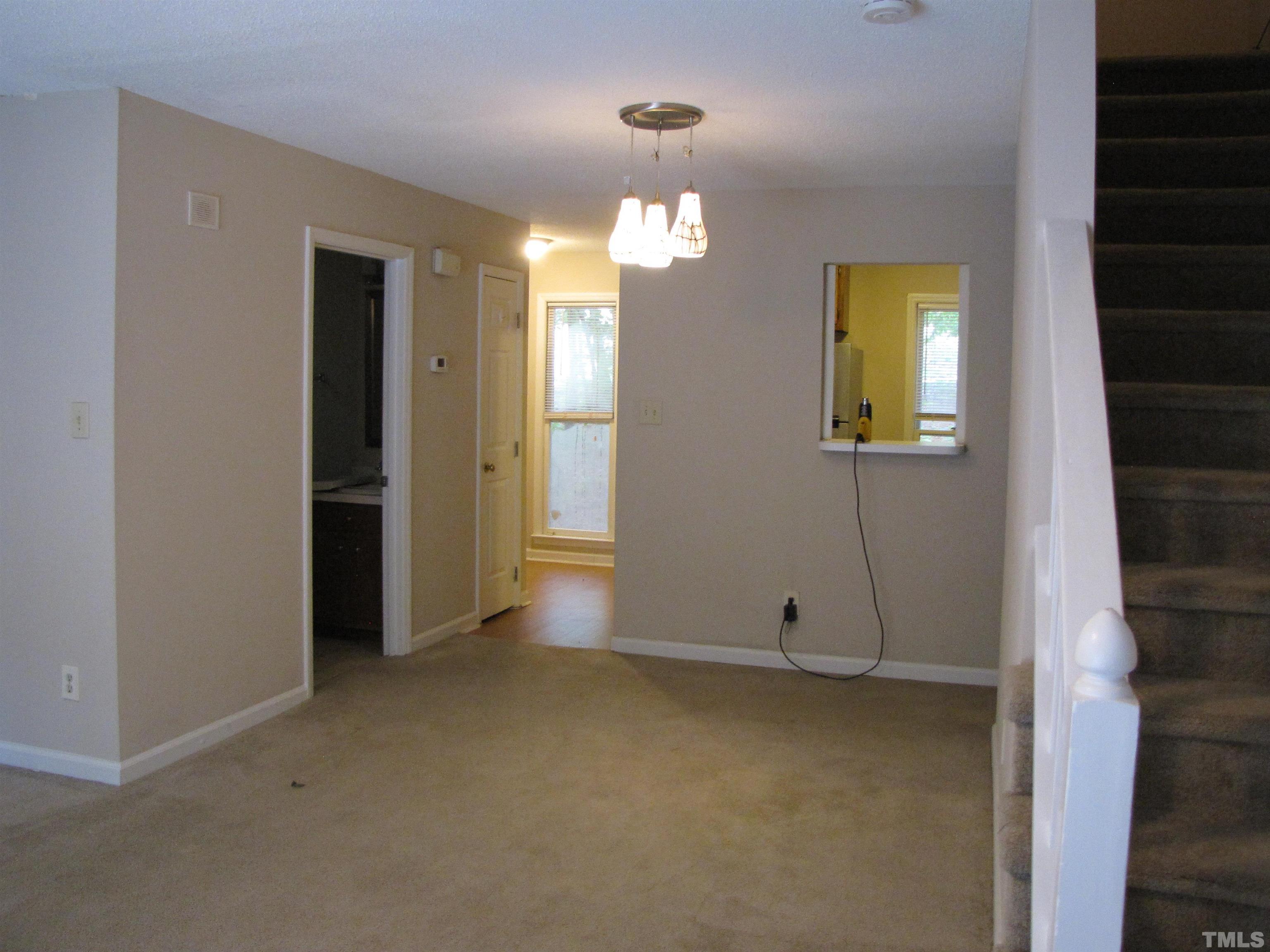 2 Carson Circle, Unit B Durham, NC 27705 - Photo 3 of 15 wooden floor in an empty room with a window