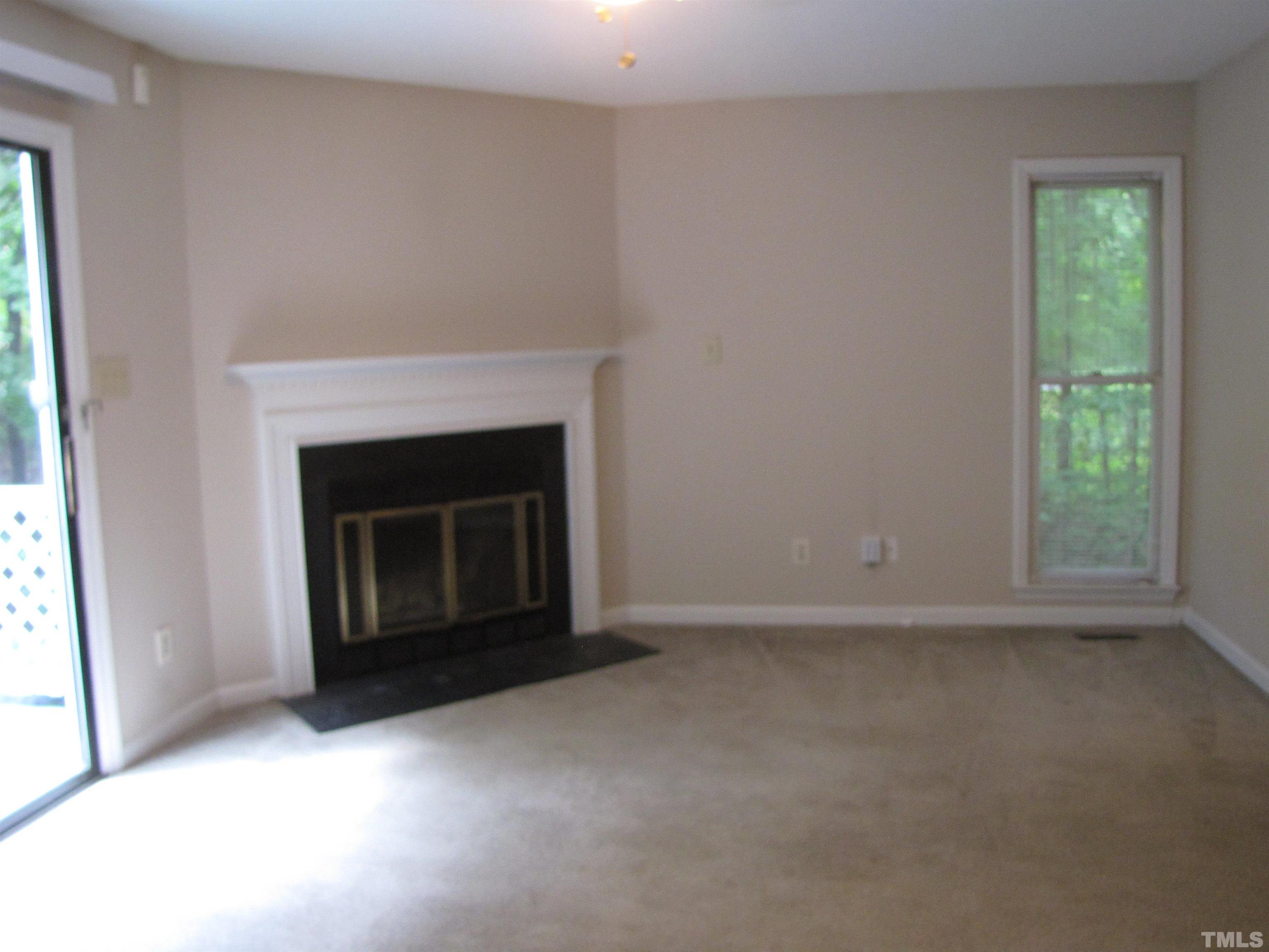2 Carson Circle, Unit B Durham, NC 27705 - Photo 4 of 15 an empty room with a fireplace