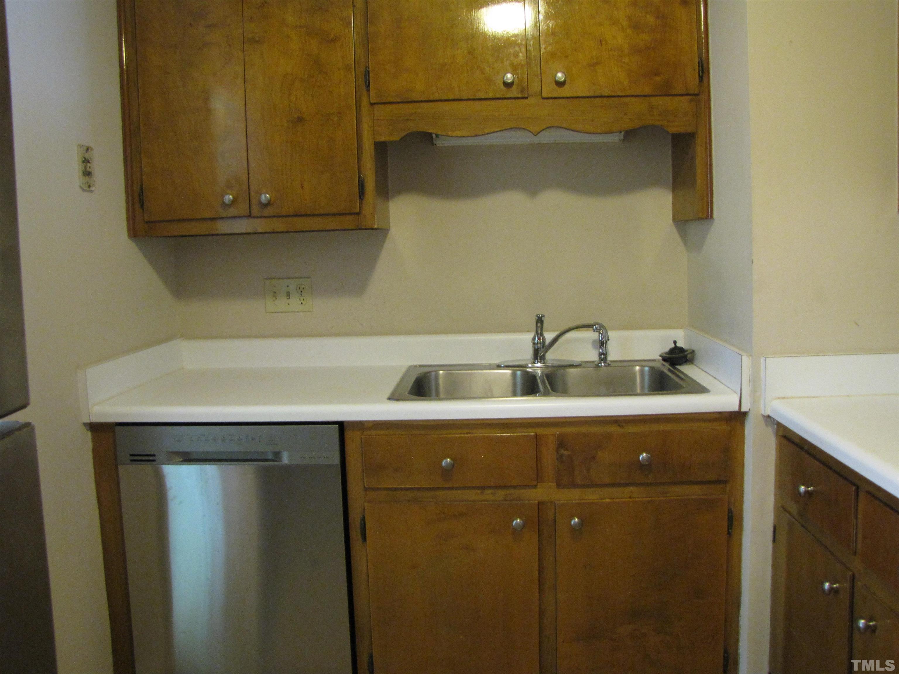 2 Carson Circle, Unit B Durham, NC 27705 - Photo 7 of 15 a utility room with a sink and cabinets