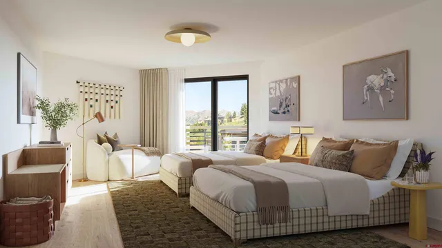 a bedroom with a bed and a couch