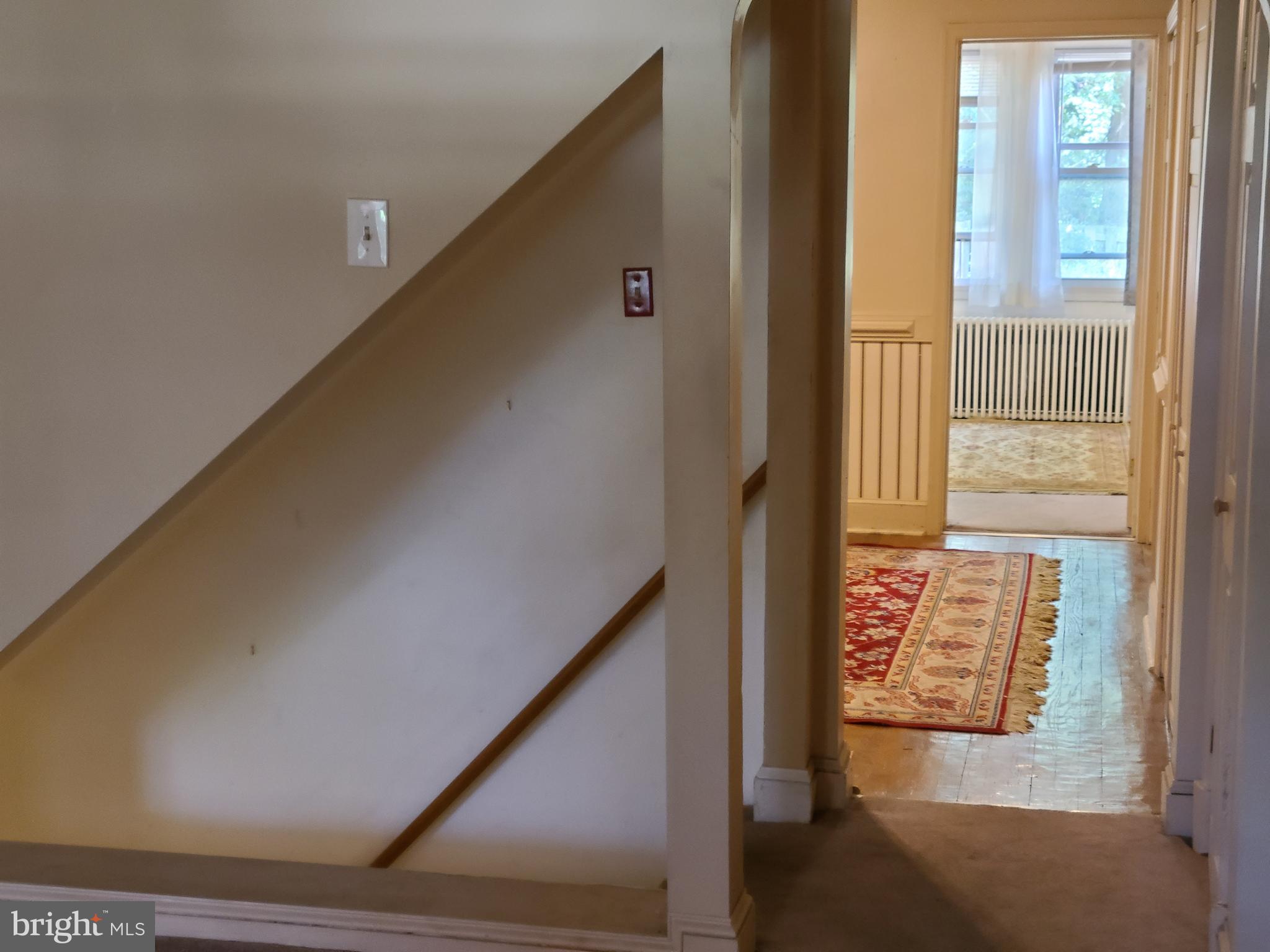 243 Mallow Hill Road Baltimore, MD 21229 - Photo 3 of 17 Main level hall and stairs to lower level