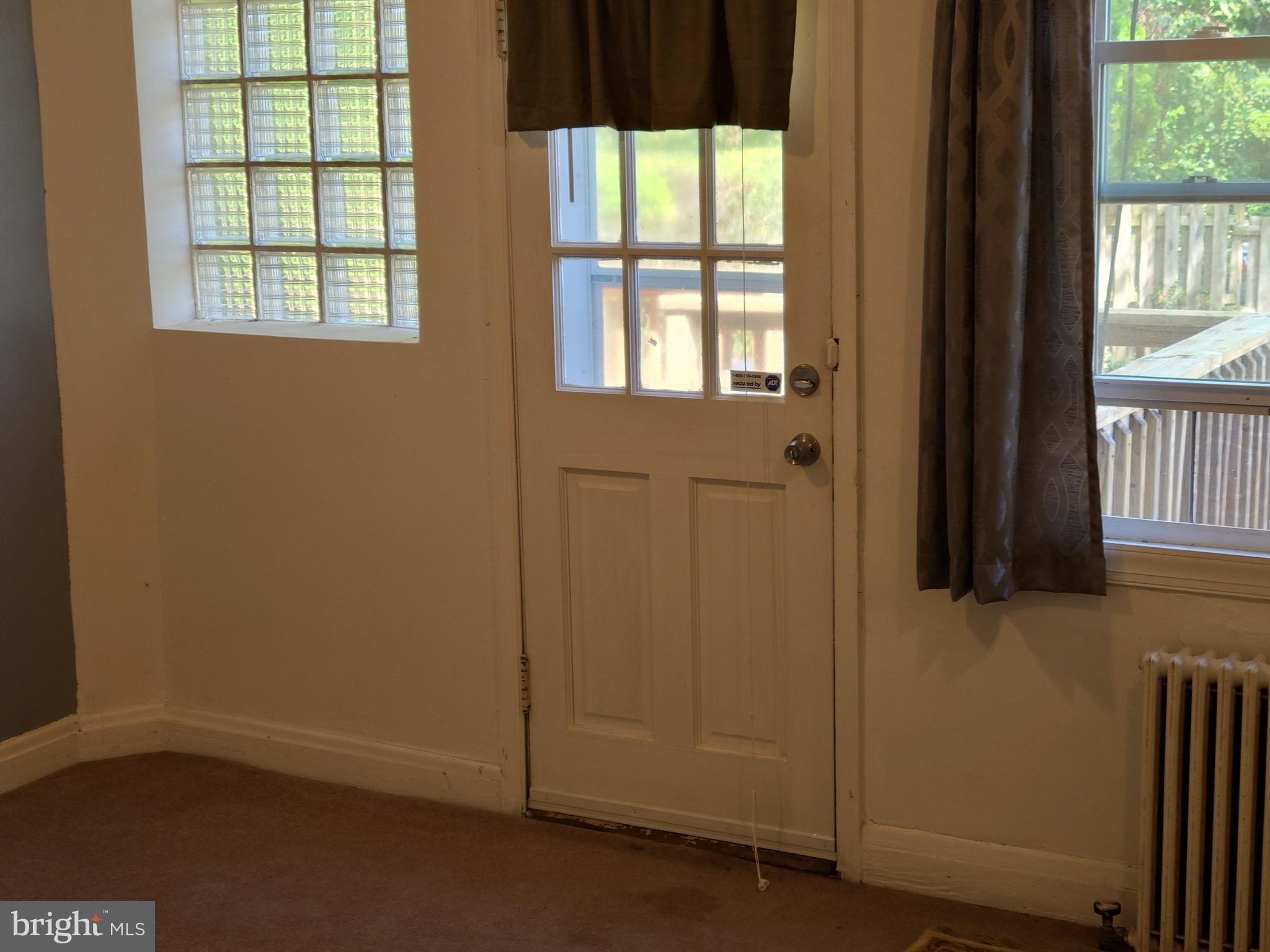 243 Mallow Hill Road Baltimore, MD 21229 - Photo 4 of 17 Back room and door to rear deck & yard