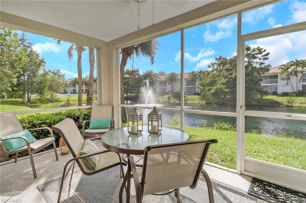 6923 Satinleaf Road North, Unit 101 Naples, FL 34109 - Photo 24 of 50 a view of a porch with chairs and backyard