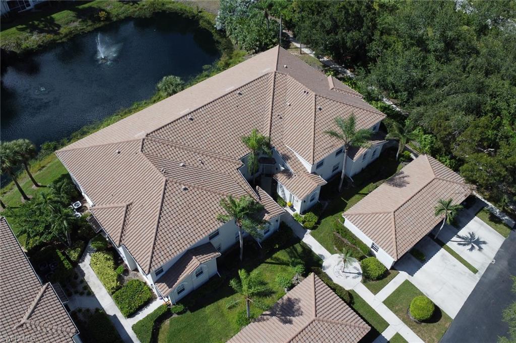 6923 Satinleaf Road North, Unit 101 Naples, FL 34109 - Photo 28 of 50 an aerial view of a house