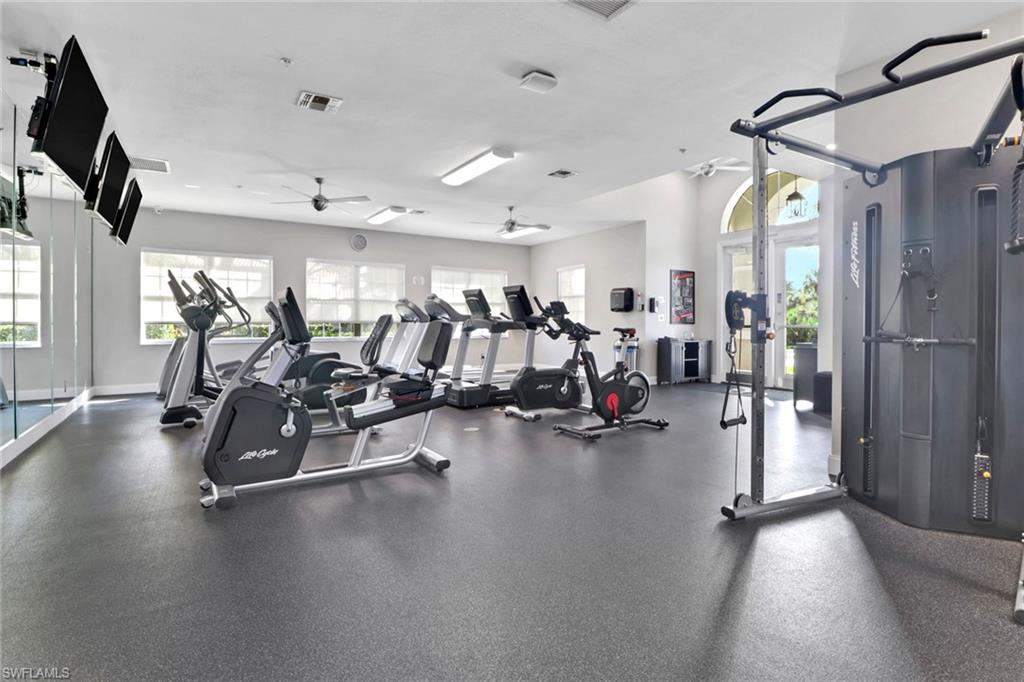 6923 Satinleaf Road North, Unit 101 Naples, FL 34109 - Photo 35 of 50 a view of a room with gym equipment