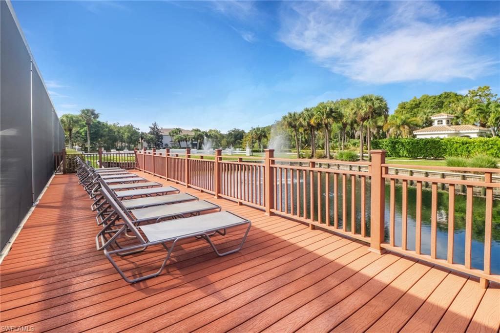 6923 Satinleaf Road North, Unit 101 Naples, FL 34109 - Photo 37 of 50 a view of a wooden deck with a yard