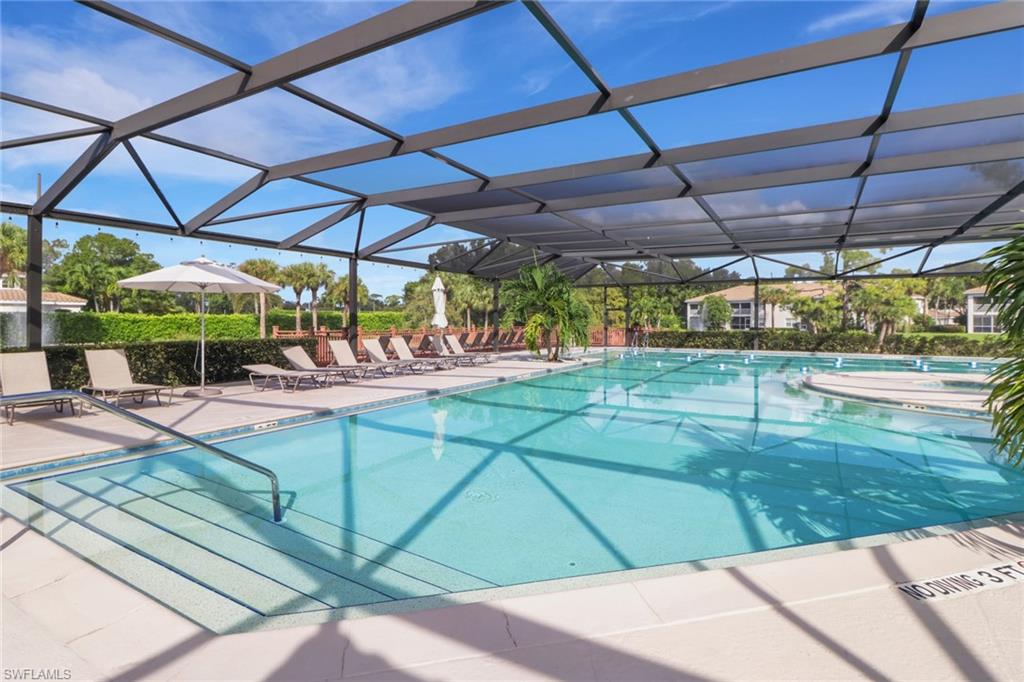 6923 Satinleaf Road North, Unit 101 Naples, FL 34109 - Photo 45 of 50 a view of a indoor swimming pool