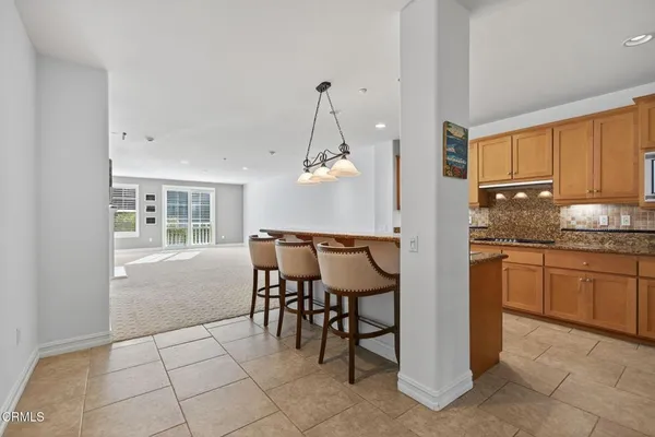 a kitchen with a table and chairs