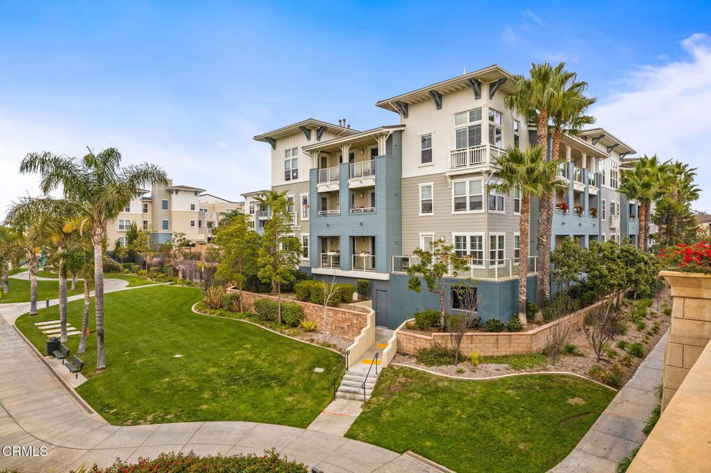 1423 Windshore Way Oxnard, CA 93035 - Photo 52 of 64 a view of a house with swimming pool and a yard