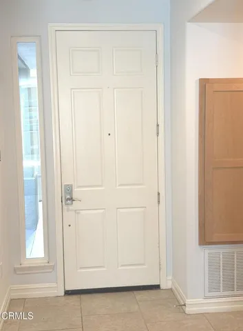 a view of a livingroom with a fireplace and window