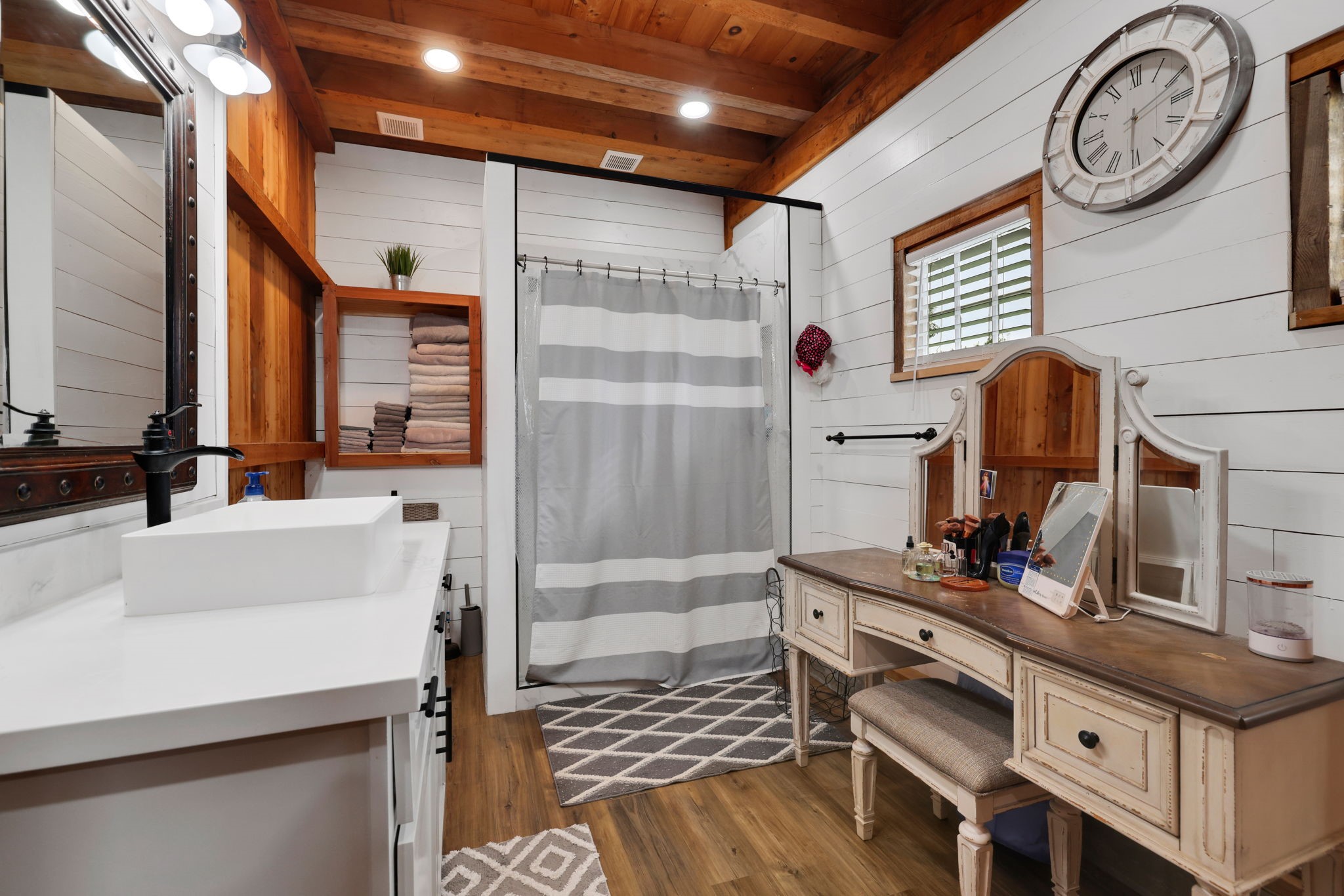 133 Timber Ridge Road Liberty, TX 77575 - Photo 16 of 29 a bathroom with a sink a vanity and a mirror