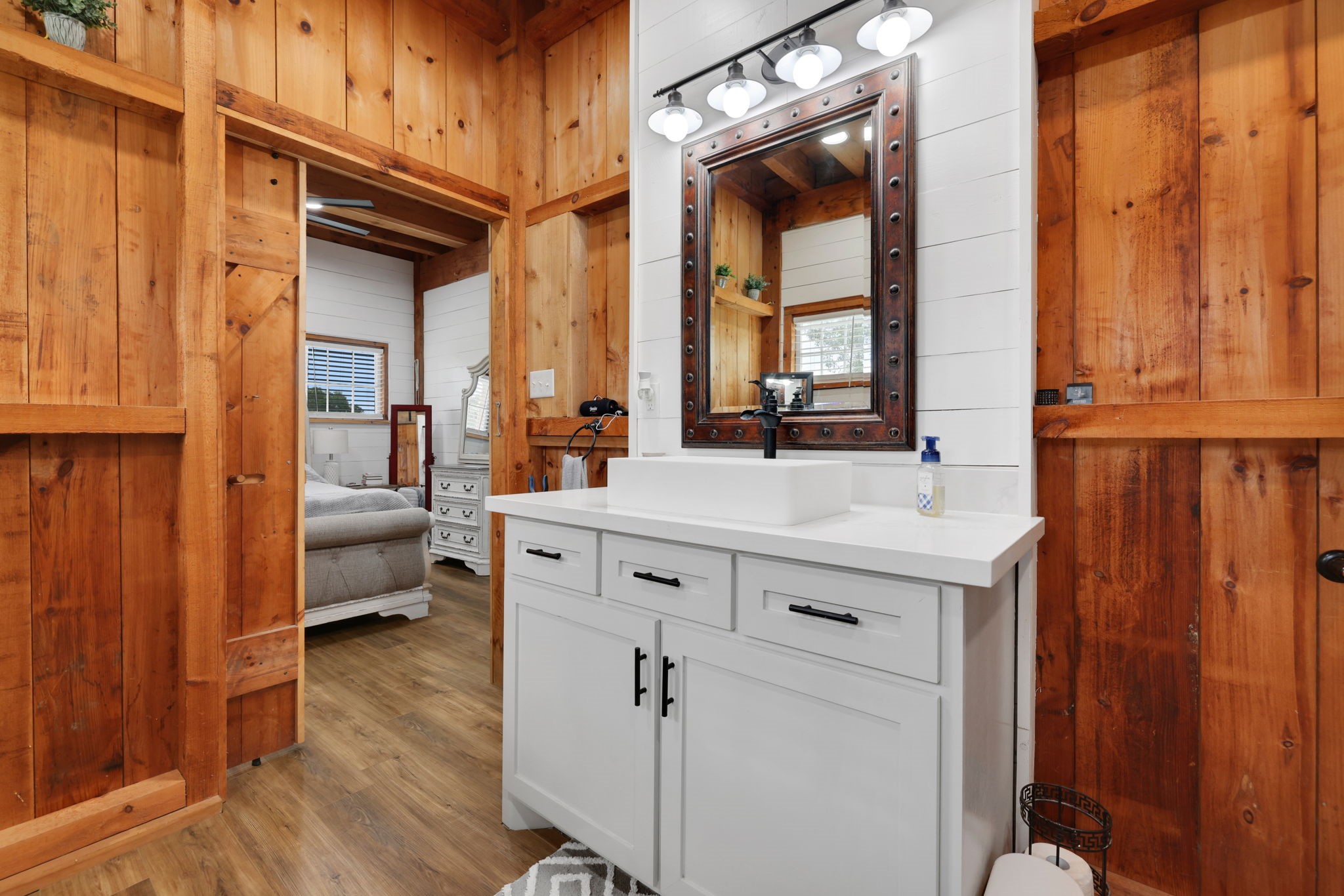 133 Timber Ridge Road Liberty, TX 77575 - Photo 17 of 29 a spacious bathroom with a double vanity sink and a mirror