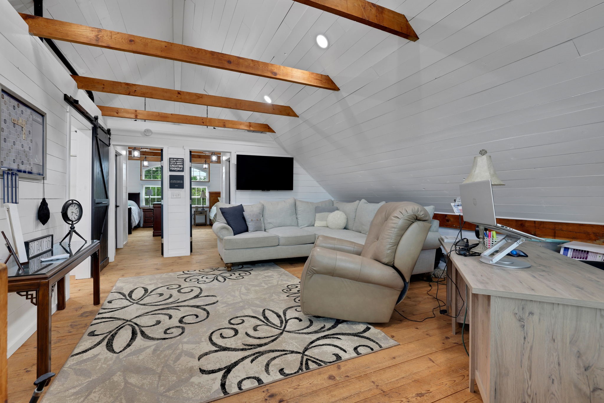 133 Timber Ridge Road Liberty, TX 77575 - Photo 18 of 29 a living room with furniture and a flat screen tv