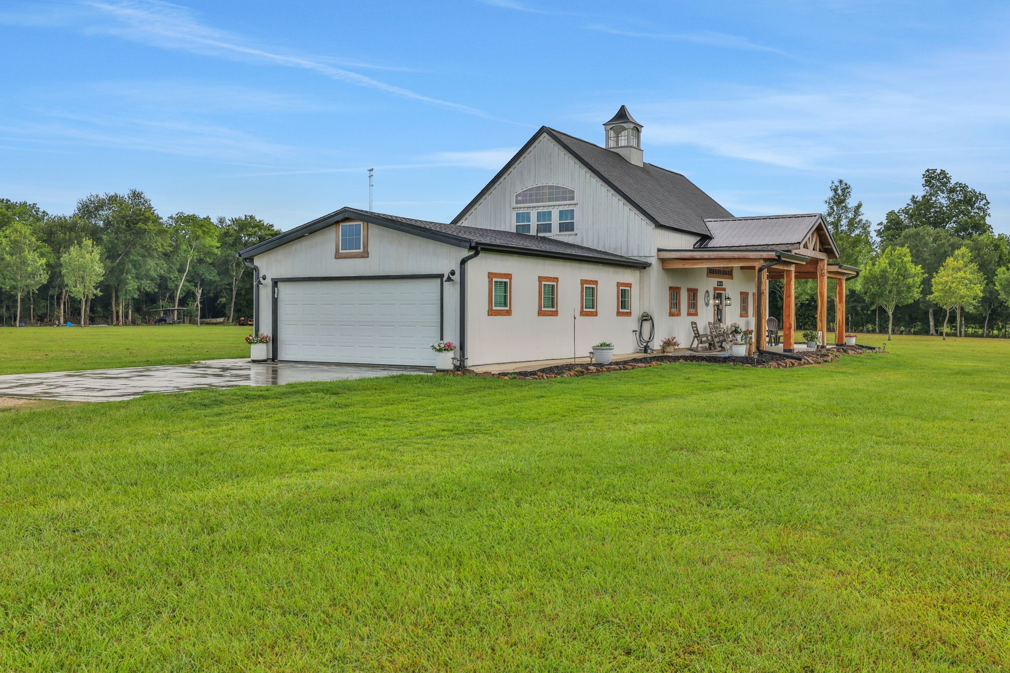 133 Timber Ridge Road Liberty, TX 77575 - Photo 2 of 29 a front view of a house with a garden