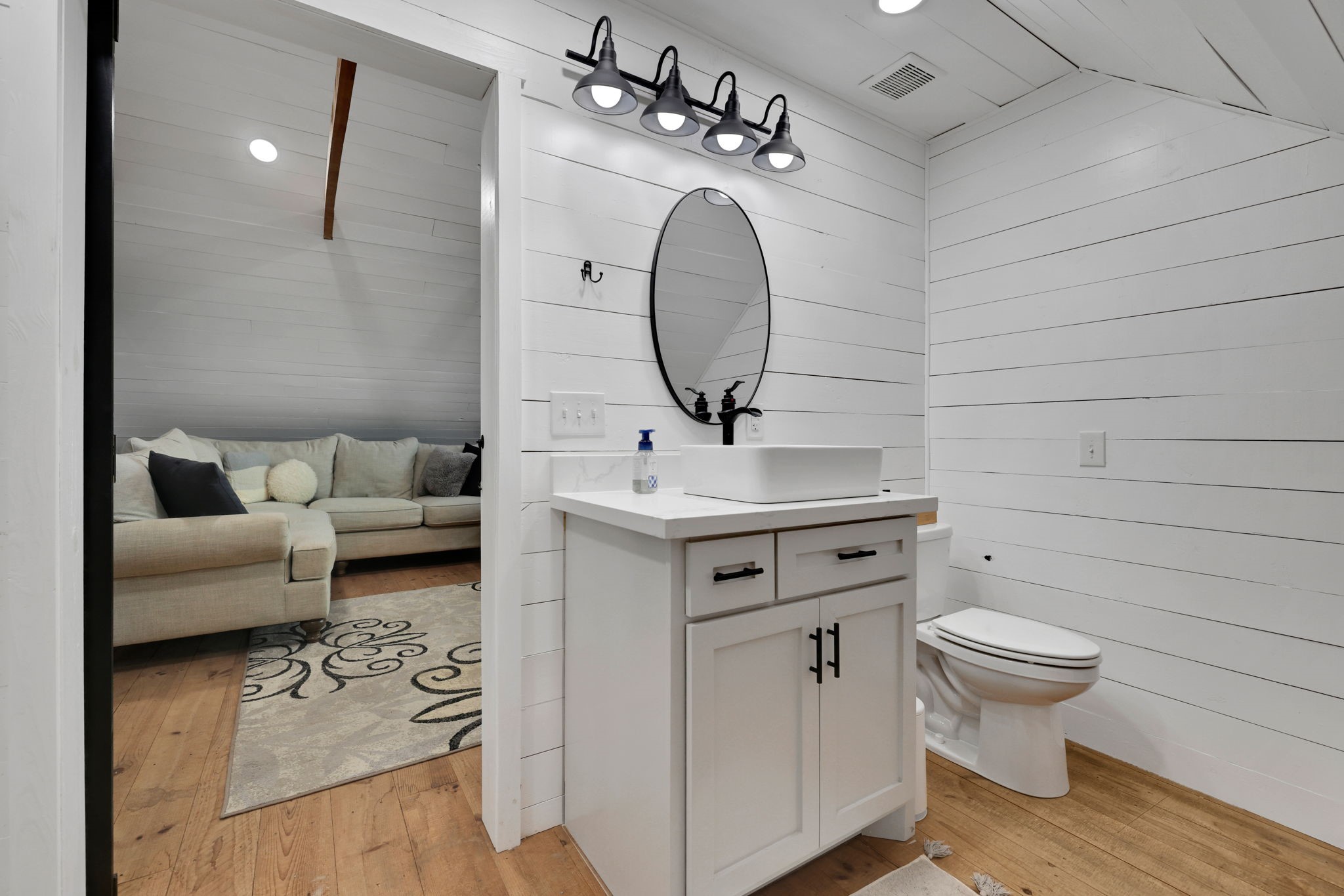 133 Timber Ridge Road Liberty, TX 77575 - Photo 21 of 29 a bathroom with a toilet sink and mirror