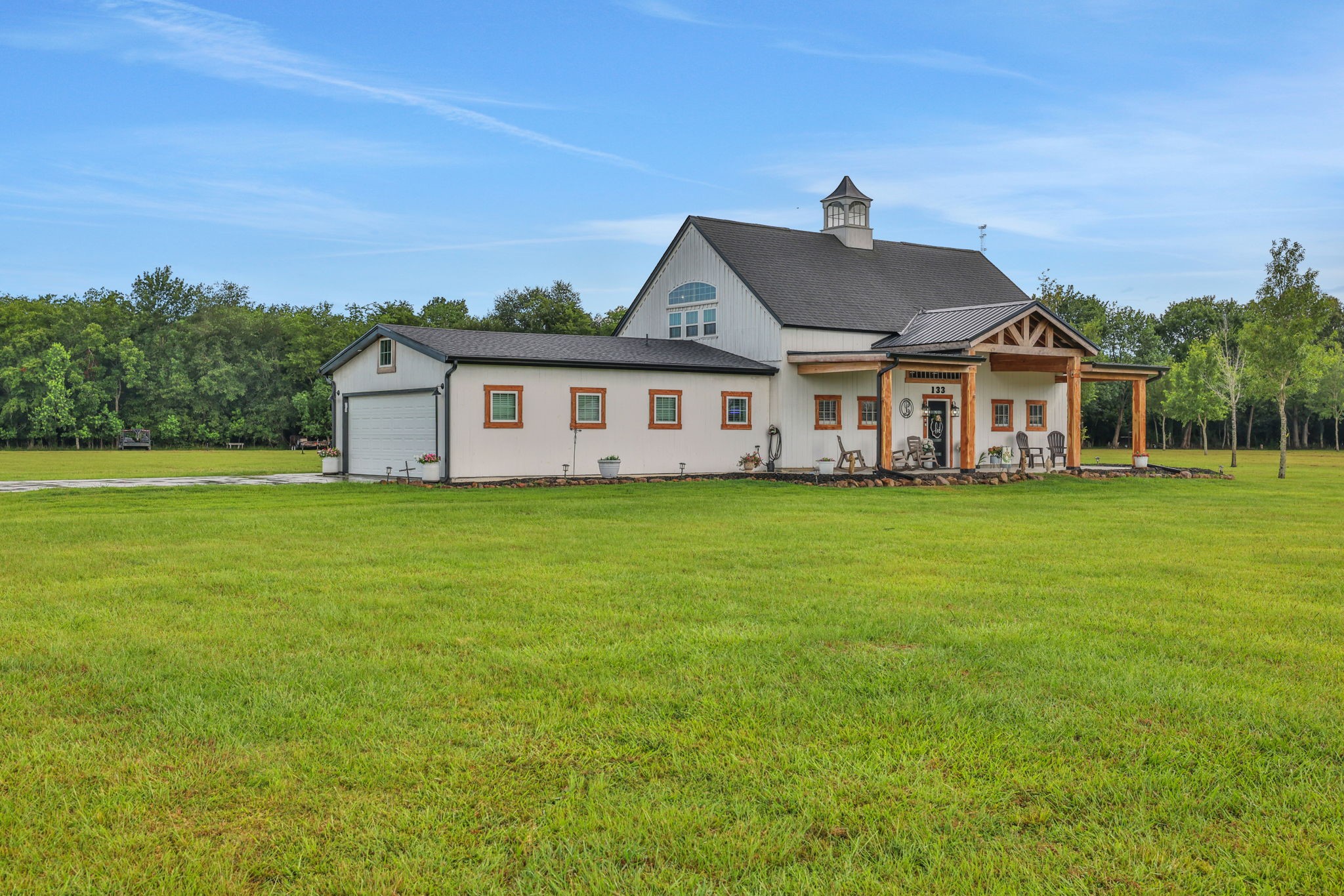 133 Timber Ridge Road Liberty, TX 77575 - Photo 27 of 29 a front view of a house with a garden