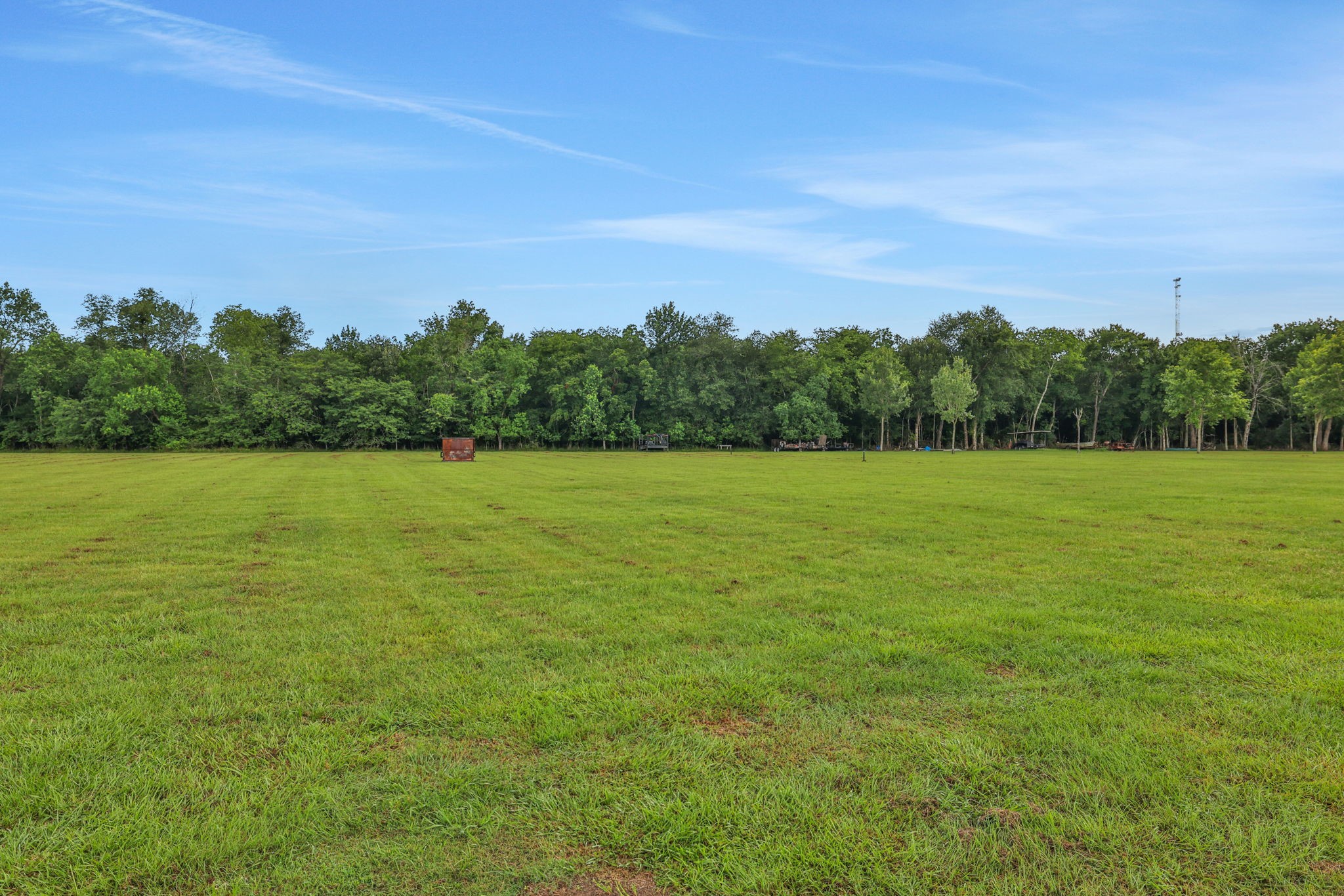 133 Timber Ridge Road Liberty, TX 77575 - Photo 29 of 29 a view of a green field with an ocean view