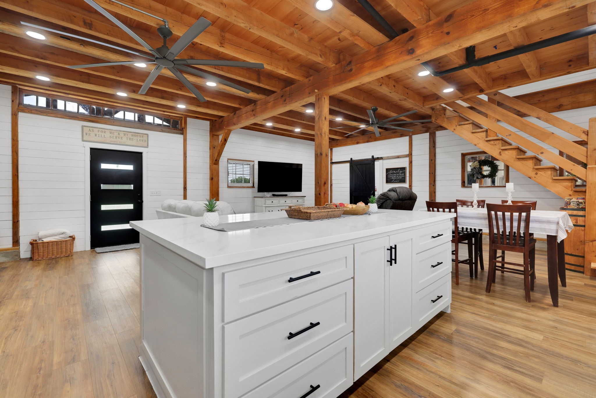133 Timber Ridge Road Liberty, TX 77575 - Photo 10 of 29 a view of a kitchen with kitchen island granite countertop a sink cabinets and wooden floor