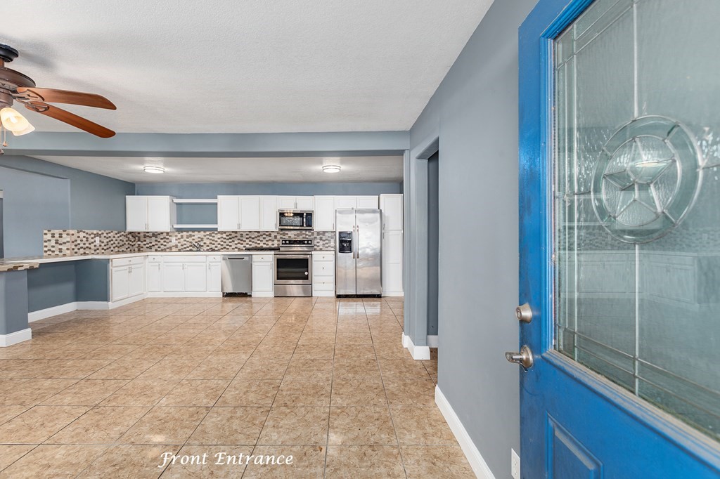 2915 Freeman Street Lufkin, TX 75901 - Photo 10 of 33 a large white kitchen with a sink and refrigerator