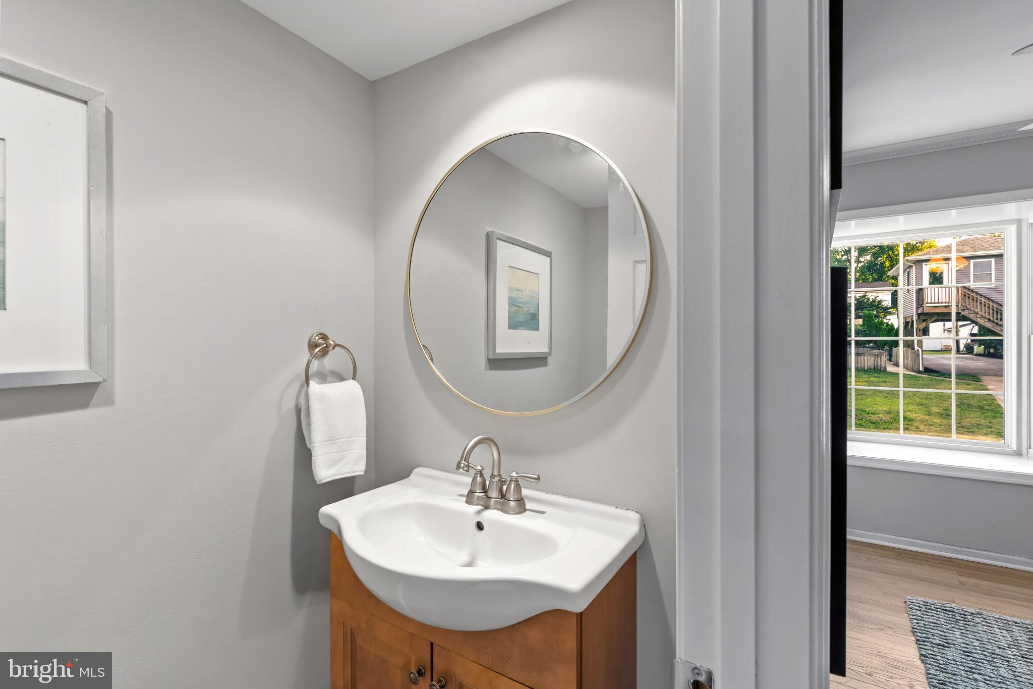 310 Magothy Road Severna Park, MD 21146 - Photo 13 of 38 a bathroom with a sink and a mirror
