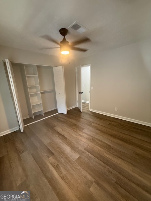 224 Twiggs Corners Peachtree City, GA 30269 - Photo 12 of 28 an empty room with wooden floor and windows