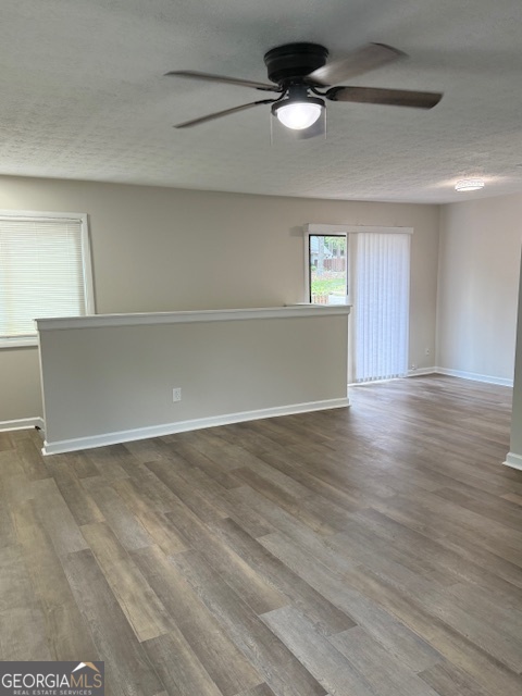 224 Twiggs Corners Peachtree City, GA 30269 - Photo 2 of 28 a view of an empty room with a window and wooden floor