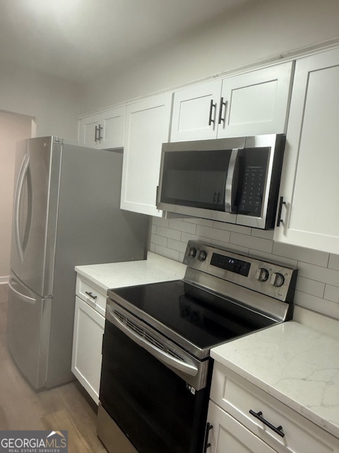 224 Twiggs Corners Peachtree City, GA 30269 - Photo 6 of 28 a kitchen with a refrigerator stove and microwave