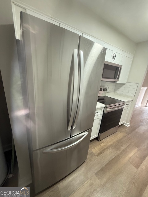 224 Twiggs Corners Peachtree City, GA 30269 - Photo 8 of 28 a living room with stainless steel appliances and furniture