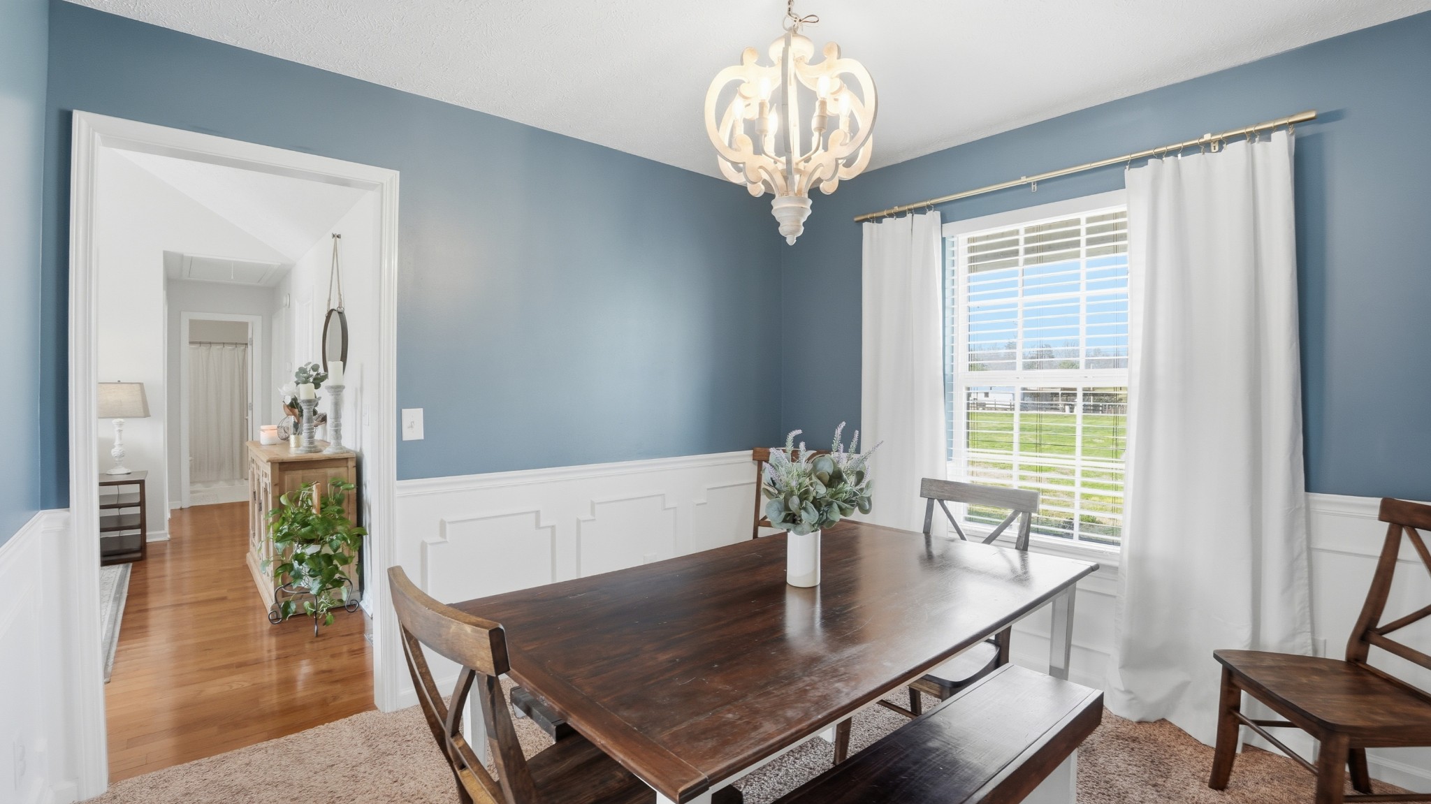 2877 Sixteenth Model Road Manchester, TN 37355 - Photo 16 of 38 a view of a dining room with furniture window and wooden floor
