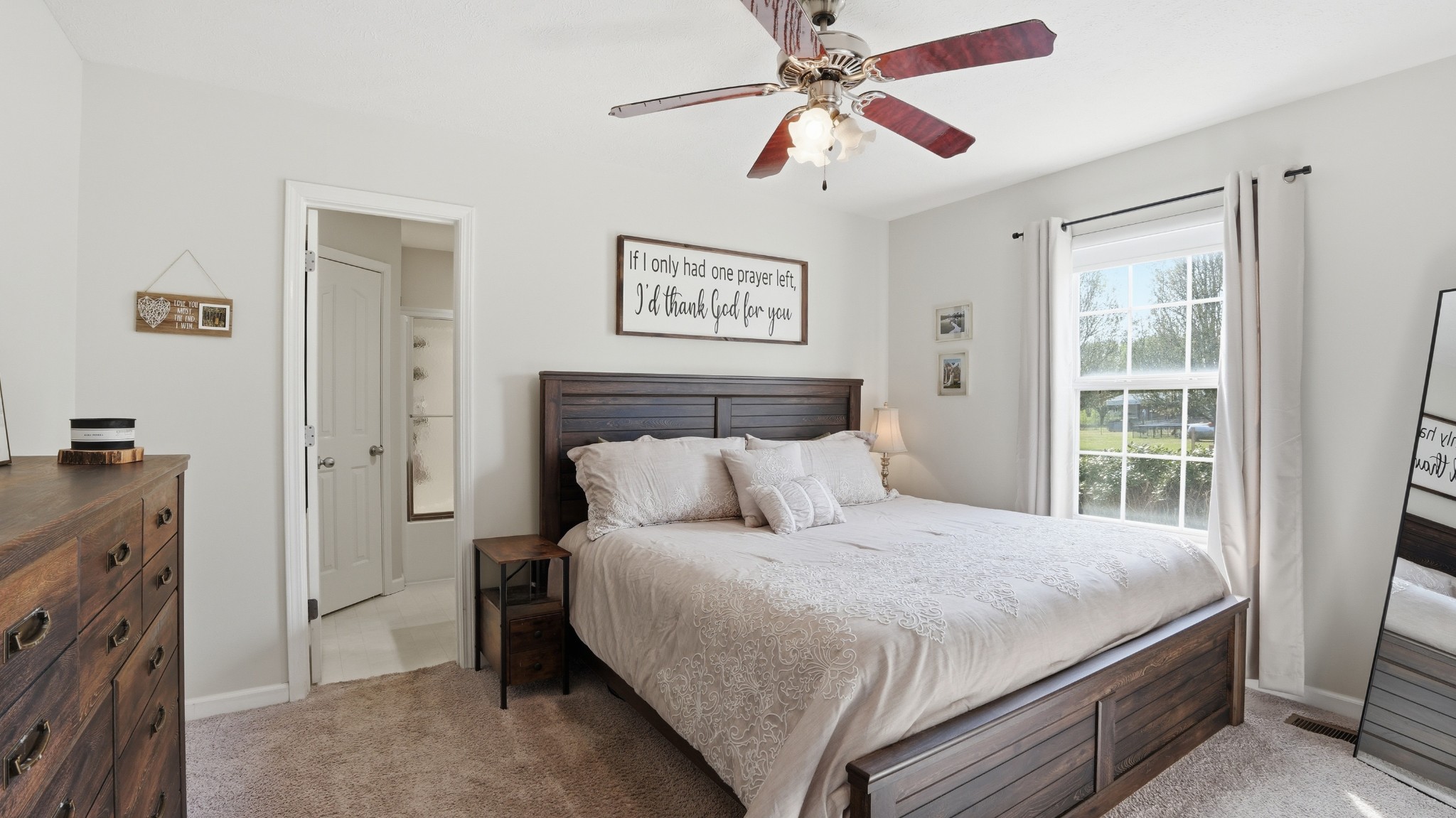 2877 Sixteenth Model Road Manchester, TN 37355 - Photo 24 of 38 a bedroom with a bed and a chandelier