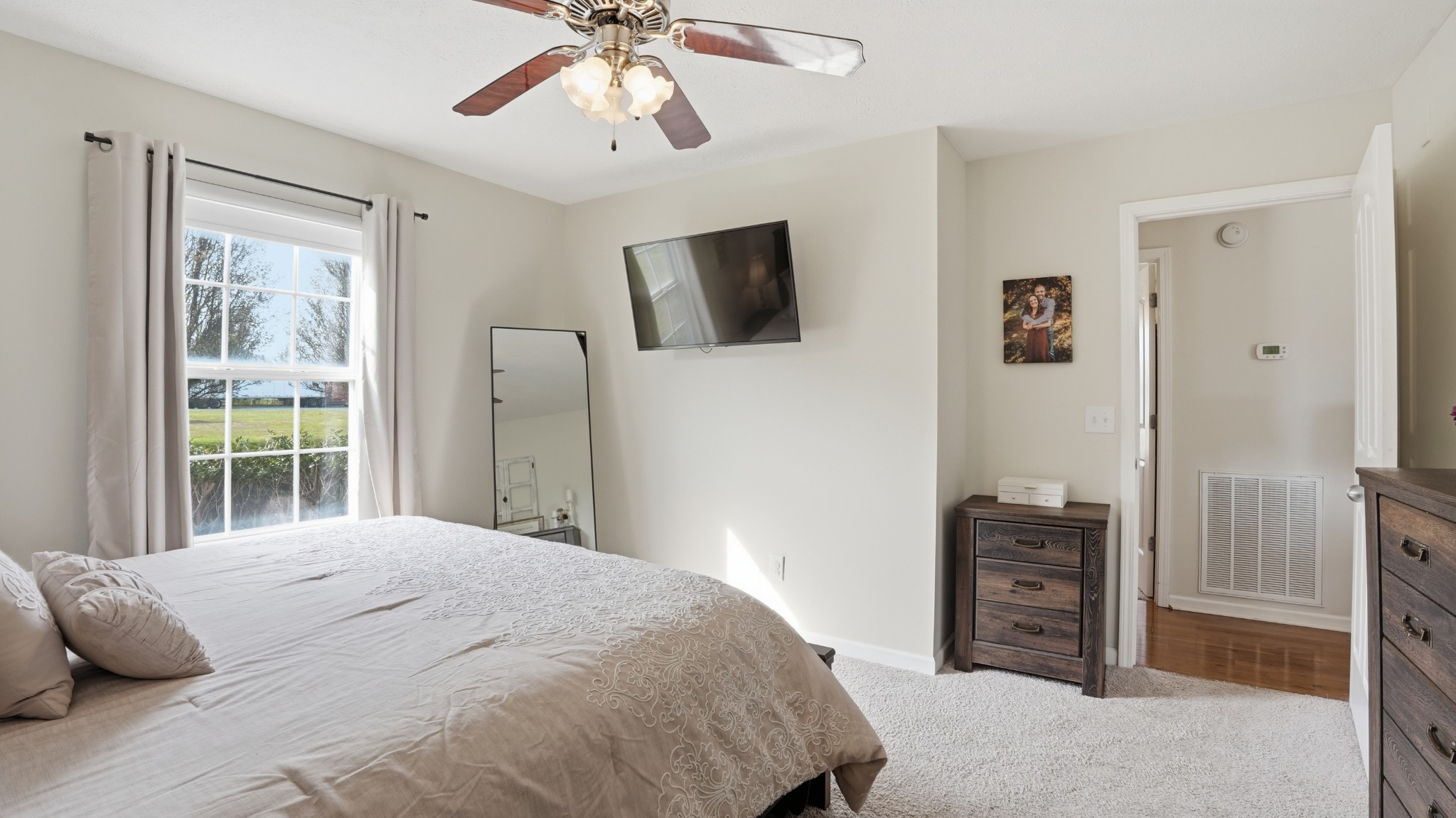 2877 Sixteenth Model Road Manchester, TN 37355 - Photo 26 of 38 a bedroom with a bed and a flat screen tv