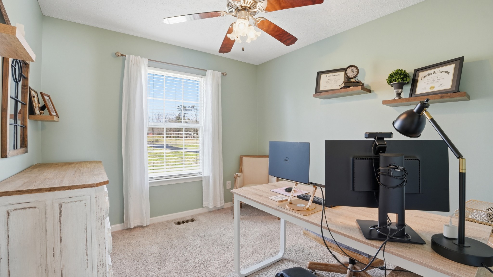 2877 Sixteenth Model Road Manchester, TN 37355 - Photo 30 of 38 a view of a workspace with furniture and a window