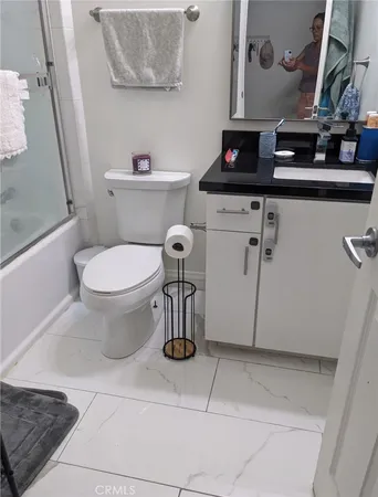 a bathroom with a toilet and a sink
