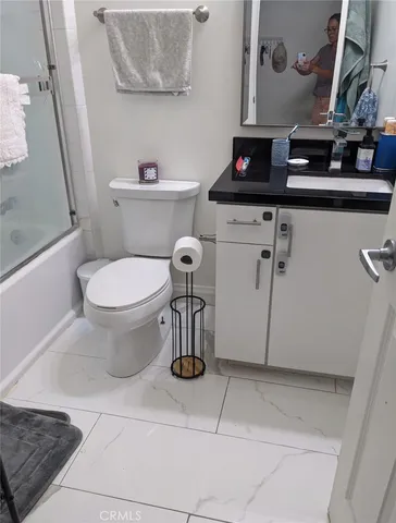 a bathroom with a toilet and a sink