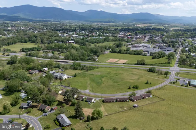 an aerial view of residential houses and outdoor space