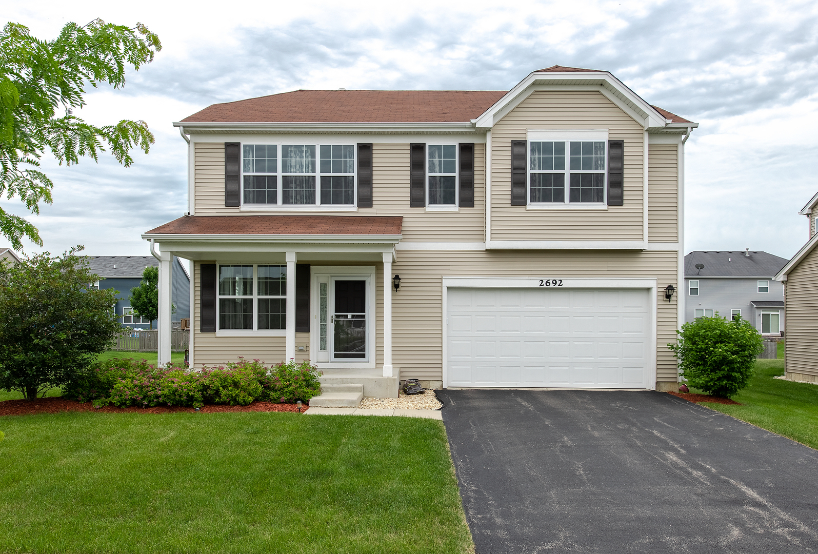 2692 Reedgrass Way Wauconda, IL 60084 - Photo 1 of 22 a front view of a house with a yard