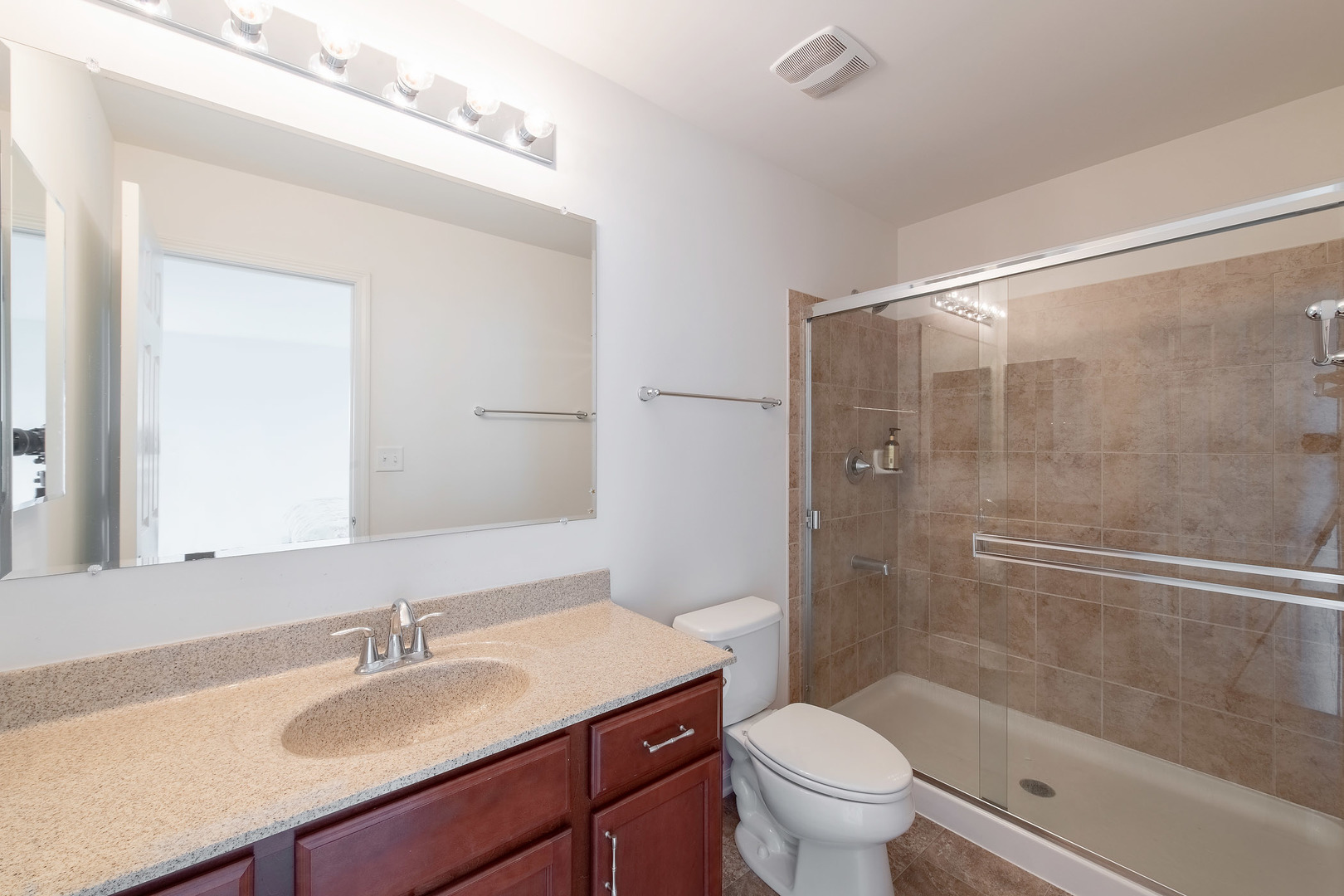 2692 Reedgrass Way Wauconda, IL 60084 - Photo 14 of 22 a bathroom with a granite countertop sink toilet and shower