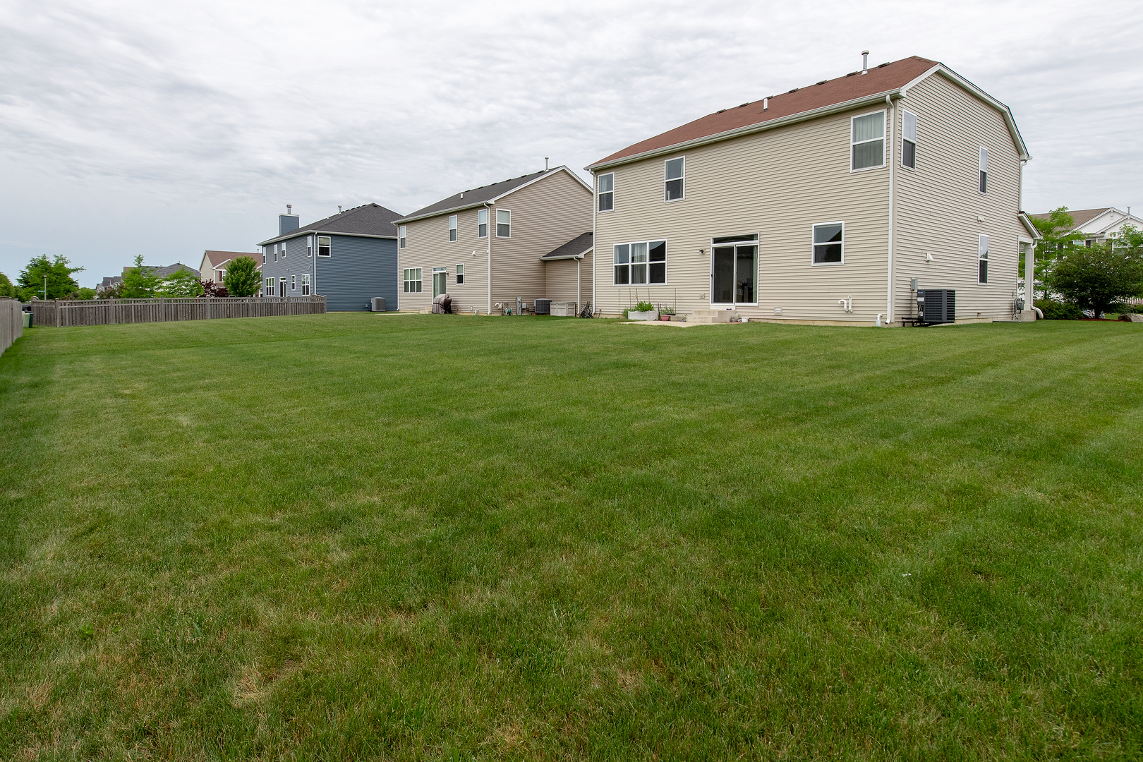 2692 Reedgrass Way Wauconda, IL 60084 - Photo 21 of 22 a view of a white house with a big yard